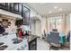 Bright kitchen with black cabinets, marble counters, and a view to the dining room at 3002 N 32Nd St # 13, Phoenix, AZ 85018