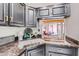 Close up on the kitchen sink area and pass-through to the living room at 3002 N 32Nd St # 13, Phoenix, AZ 85018