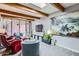 Spacious living room with skylight, exposed beams, and view of the landscaped backyard at 3002 N 32Nd St # 13, Phoenix, AZ 85018