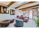 Bright living room with skylight, exposed beams, and access to the patio at 3002 N 32Nd St # 13, Phoenix, AZ 85018