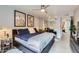 Main bedroom with a ceiling fan, walk-in closet, and a view of the outside at 3002 N 32Nd St # 13, Phoenix, AZ 85018