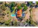 Stunning aerial view of home, surrounded by desert landscaping, pool, solar panels, and privacy at 3264 E Vineyard Rd, Phoenix, AZ 85042