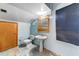 Traditional bathroom with light blue walls, toilet, and vanity sink at 3264 E Vineyard Rd, Phoenix, AZ 85042