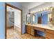 Bathroom with a vanity and a view to a tub/shower combo at 3264 E Vineyard Rd, Phoenix, AZ 85042