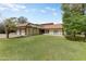 Single-Gathering home with a tile roof, two-car garage, and a well-maintained lawn at 3264 E Vineyard Rd, Phoenix, AZ 85042