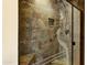 Walk-in shower stall features decorative glass door and tiled walls at 3264 E Vineyard Rd, Phoenix, AZ 85042
