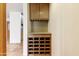 Custom wood wine rack with granite counter offers ample wine storage and display space at 3264 E Vineyard Rd, Phoenix, AZ 85042