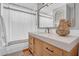 Bathroom with wood vanity, quartz countertop, and modern decor at 3338 E Turney Ave, Phoenix, AZ 85018