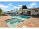 Inviting backyard pool with a diving board, spa, patio and covered seating area for outdoor enjoyment at 3338 E Turney Ave, Phoenix, AZ 85018