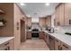 Modern kitchen with sleek cabinetry, stainless steel appliances, and light countertops, creating a bright space at 3407 E Hubbell St, Phoenix, AZ 85008