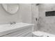 Updated bathroom with modern fixtures, a walk-in shower, and a sleek vanity at 3626 W Elm St, Phoenix, AZ 85019
