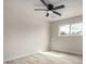Bright bedroom with new wood flooring and a ceiling fan at 3626 W Elm St, Phoenix, AZ 85019