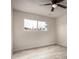 Bright bedroom featuring new flooring and paint with large windows at 3626 W Elm St, Phoenix, AZ 85019