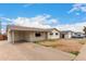 Spacious single-story home with a covered carport, modern siding, and a neatly paved driveway at 3626 W Elm St, Phoenix, AZ 85019