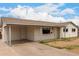 Well-maintained home featuring a covered carport and a clean exterior design with ample front parking at 3626 W Elm St, Phoenix, AZ 85019