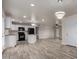 Modern kitchen featuring stainless steel appliances and an open layout for easy entertaining at 3626 W Elm St, Phoenix, AZ 85019