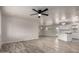 Bright, open living space with modern ceiling fan and beautiful hardwood flooring at 3626 W Elm St, Phoenix, AZ 85019
