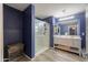 Bathroom featuring a glass-enclosed shower and a modern double vanity at 40262 W Molly Ln # 138, Maricopa, AZ 85138