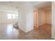Bright entryway with tiled flooring, staircase, and views into the living area at 40262 W Molly Ln # 138, Maricopa, AZ 85138