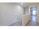 Upstairs hallway with carpet and natural light at 40262 W Molly Ln # 138, Maricopa, AZ 85138