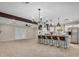 Bright, open kitchen features an island with seating and modern light fixtures at 4335 W Monterey Way, Phoenix, AZ 85031