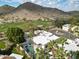 Expansive aerial view of a desert home with a pool and beautiful mountain views in the background at 4605 E Valley View Dr, Phoenix, AZ 85044