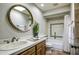 Well-lit bathroom with a shower-tub combo with decorative tiles, and a skylight at 4605 E Valley View Dr, Phoenix, AZ 85044