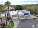 Stunning aerial view of a meticulously maintained home with a red brick driveway and lush landscaping at 4605 E Valley View Dr, Phoenix, AZ 85044