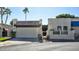 Charming front exterior with stucco walls, desert landscaping, and a two-car garage at 4605 E Valley View Dr, Phoenix, AZ 85044