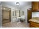 Eat-in kitchen features classic wood cabinetry, granite counters and shutters over the window at 4605 E Valley View Dr, Phoenix, AZ 85044