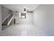 Bright living room featuring tile flooring and staircase access to upper level at 4608 W Maryland Ave # 122, Glendale, AZ 85301