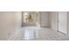 Sunlit living room with tile floors, and a bright view through a window at 4608 W Maryland Ave # 122, Glendale, AZ 85301