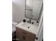 Updated bathroom featuring a stylish vanity, sleek fixtures, and a modern mirror at 4751 E White Aster St, Phoenix, AZ 85044