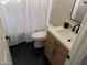 Cozy bathroom with updated vanity, modern fixtures, and hexagon tile flooring at 4751 E White Aster St, Phoenix, AZ 85044