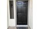 Stylish black front door providing a welcoming entrance to the home at 4751 E White Aster St, Phoenix, AZ 85044