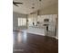Open-concept living room and kitchen area with hardwood floors and stylish design at 4751 E White Aster St, Phoenix, AZ 85044