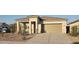 Inviting single-story home with a neutral palette, low-maintenance landscaping, and an attached two-car garage at 4919 S 106Th Ave, Tolleson, AZ 85353