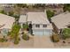 Elevated aerial view captures house's roof, landscaping, and three-car garage at 5332 W Linda Ln, Chandler, AZ 85226