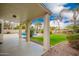 Inviting backyard with a covered patio, sparkling pool, lush lawn, and mature trees, perfect for outdoor entertaining at 5332 W Linda Ln, Chandler, AZ 85226