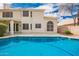 Beautiful backyard featuring a sparkling blue pool, a covered patio, and a well-maintained exterior at 5332 W Linda Ln, Chandler, AZ 85226