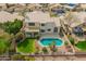 A beautiful backyard boasts a pool, lush greenery, and charming landscaping at 5332 W Linda Ln, Chandler, AZ 85226
