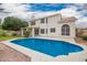 Beautiful backyard featuring a sparkling blue pool, a covered patio, and a well-maintained exterior at 5332 W Linda Ln, Chandler, AZ 85226