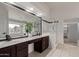 Bathroom with a double sink vanity, a large mirror and glass shower at 5332 W Linda Ln, Chandler, AZ 85226