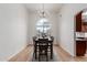 Bright dining room with decorative lighting and lots of room for seating at 5332 W Linda Ln, Chandler, AZ 85226