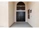 Front entryway features arched window and double doors at 5332 W Linda Ln, Chandler, AZ 85226