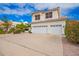 Inviting two-story home with a well-manicured yard, spacious driveway, and a two-car garage under a blue sky at 5332 W Linda Ln, Chandler, AZ 85226