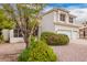 Up-close photo features a home's front, landscaping, and a glimpse of stone features at 5332 W Linda Ln, Chandler, AZ 85226