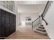 Bright foyer with dark wood door and staircase, leading to the upper level at 5332 W Linda Ln, Chandler, AZ 85226