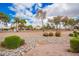 Attractive desert landscape with a gravel yard and colorful bushes in front at 5332 W Linda Ln, Chandler, AZ 85226