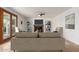 Cozy living room with fireplace, ceiling fan, and French doors leading to the outside at 5332 W Linda Ln, Chandler, AZ 85226